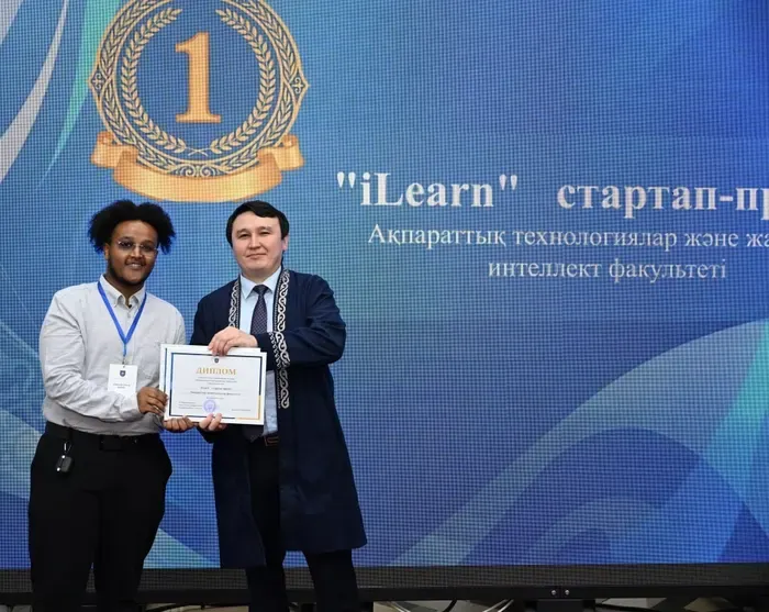 Samson receiving iLearn’s first-place award in KazNU’s Innovative Startup Projects competition from the Vice-Rector for Scientific and Innovative Activity.